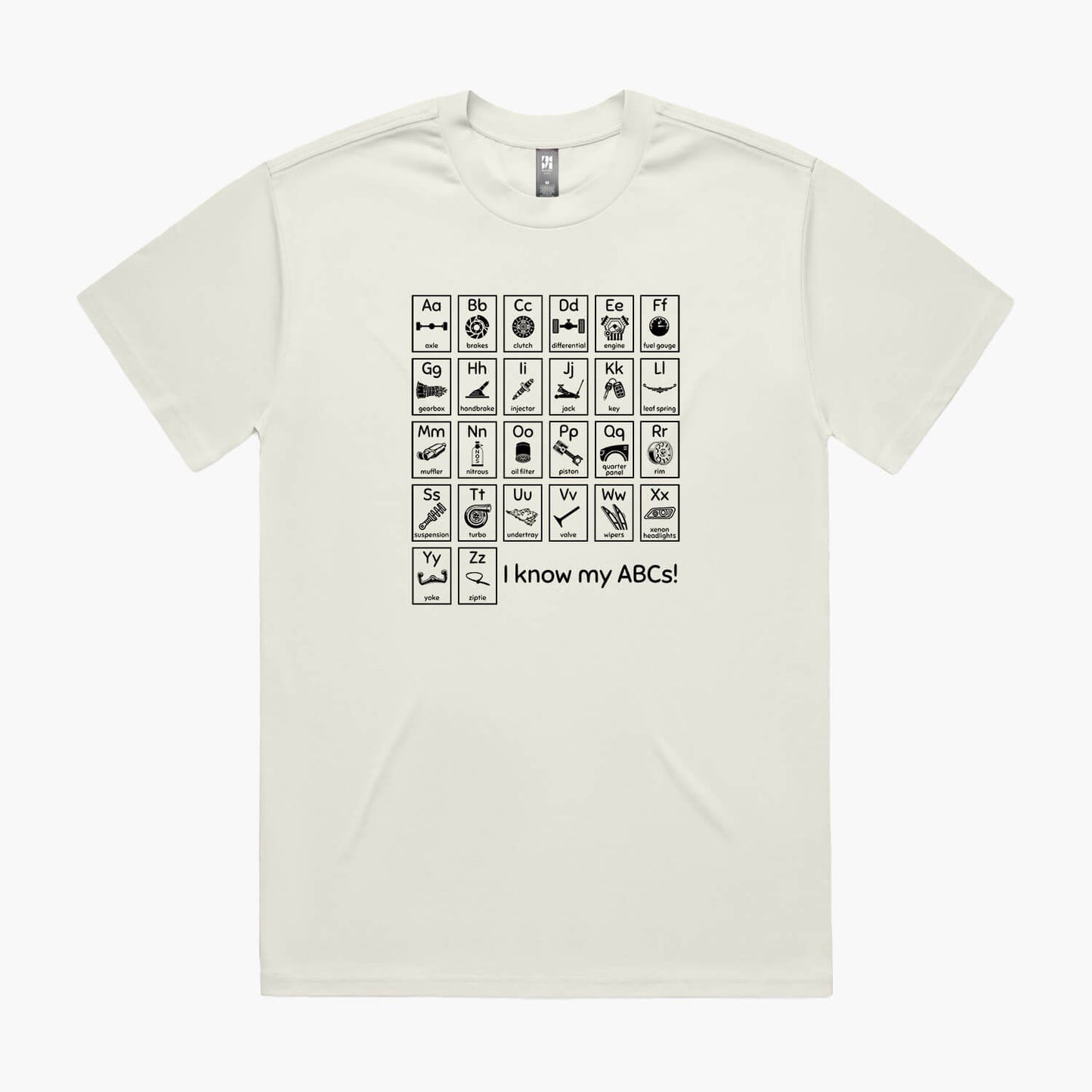 Beige oversized t-shirt with a print of an automotive-themed alphabet chart with car parts for each letter.