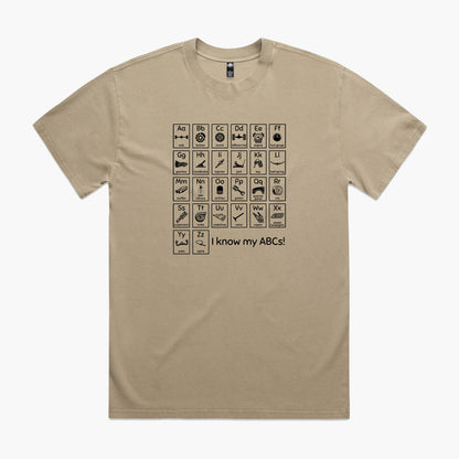 Khaki oversized t-shirt with a print of an automotive-themed alphabet chart with car parts for each letter.