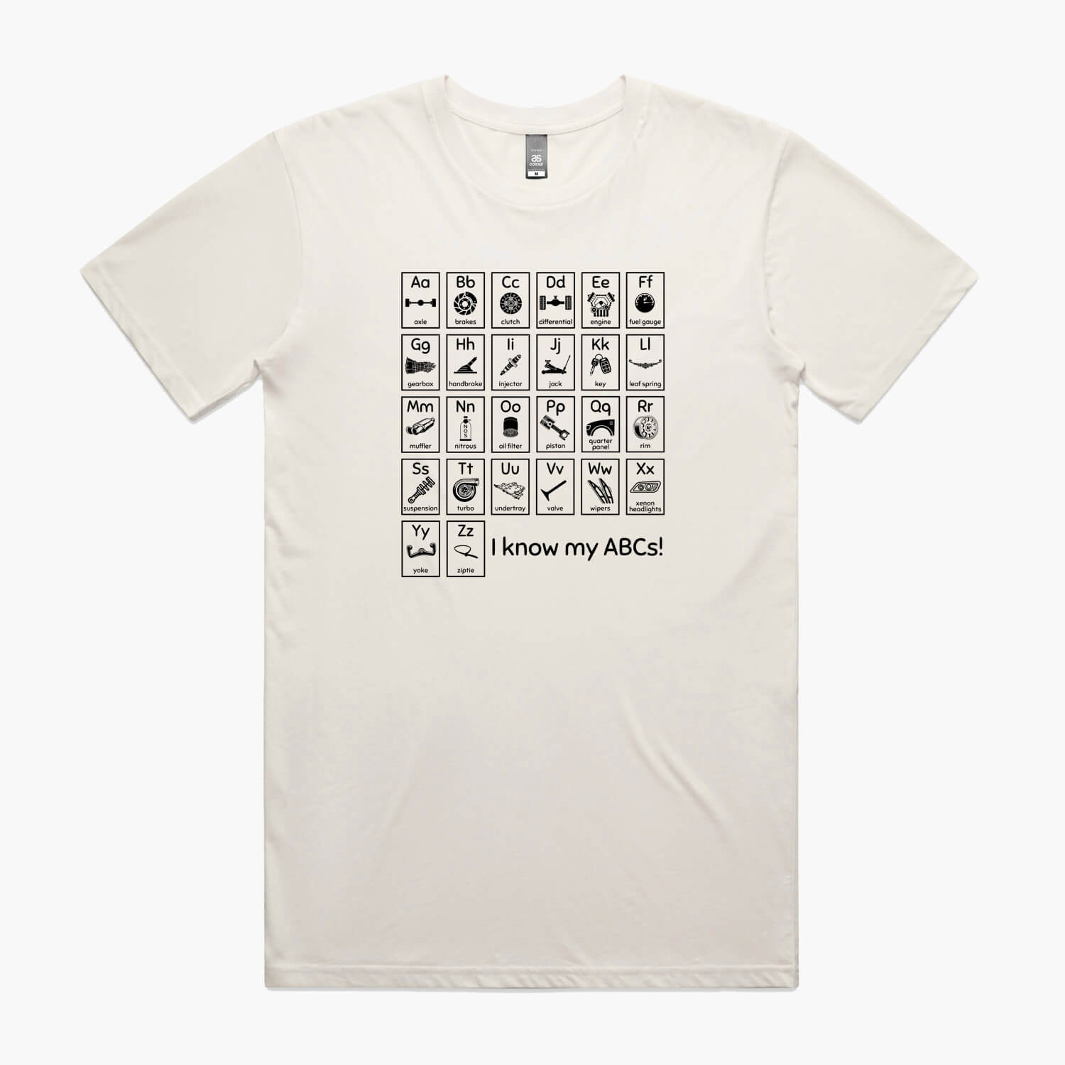 Beige t-shirt with "Car Guy Alphabet" print featuring an automotive-themed alphabet chart with car parts for each letter.