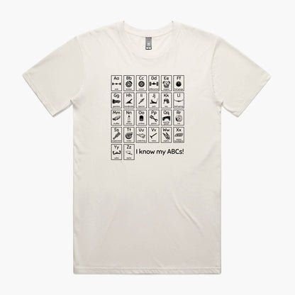 Beige t-shirt with "Car Guy Alphabet" print featuring an automotive-themed alphabet chart with car parts for each letter.